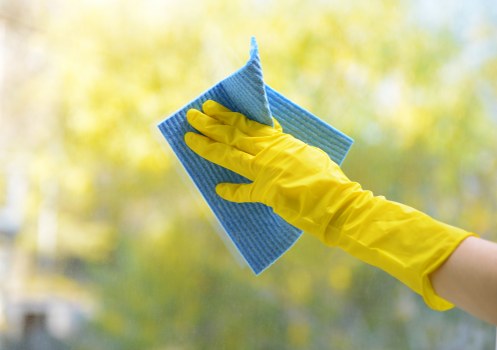 Professional window cleaning improving exterior glass clarity